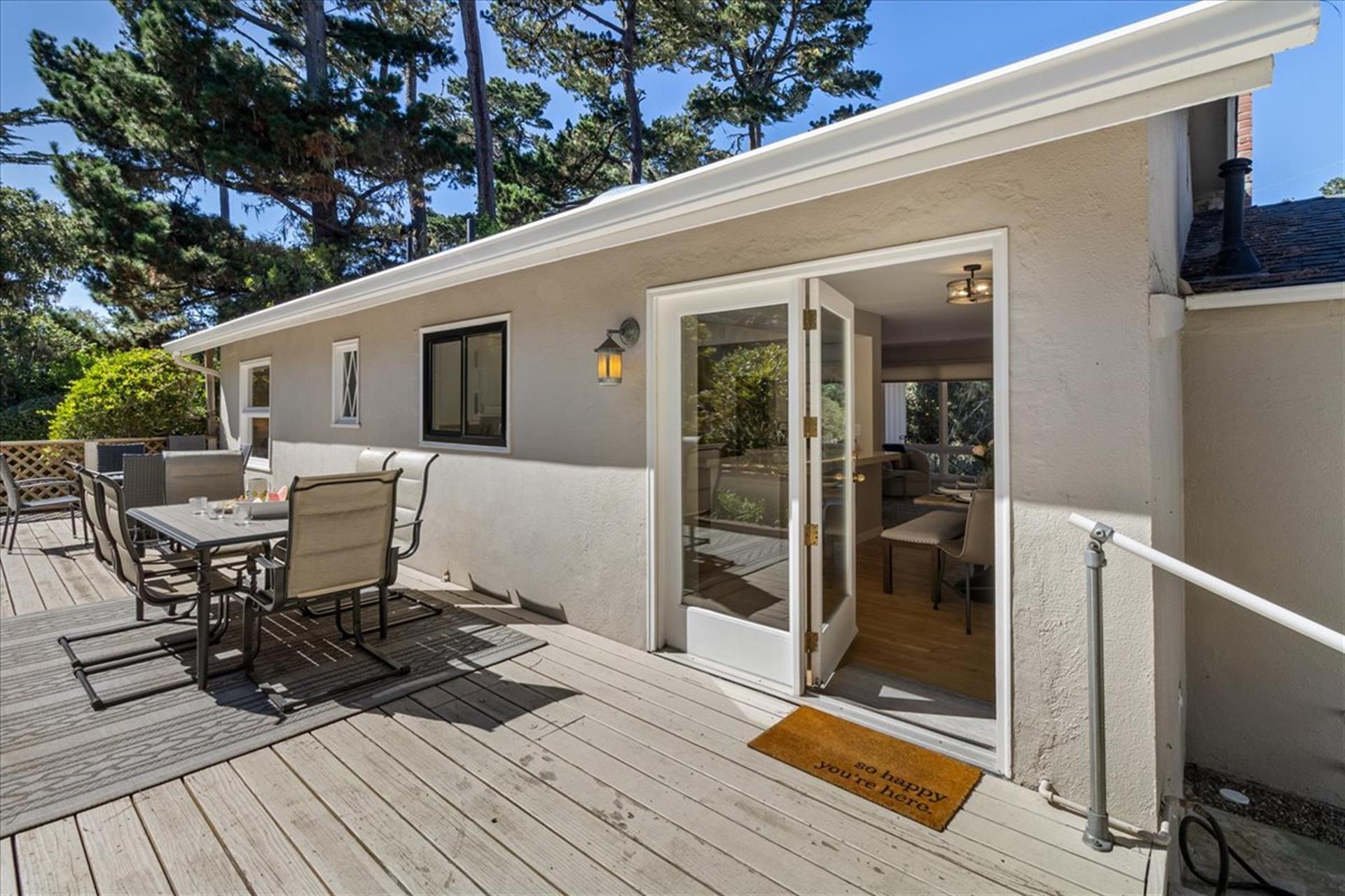 Backyard Deck has a Gas Grill, Dining Area and a Fire Pit