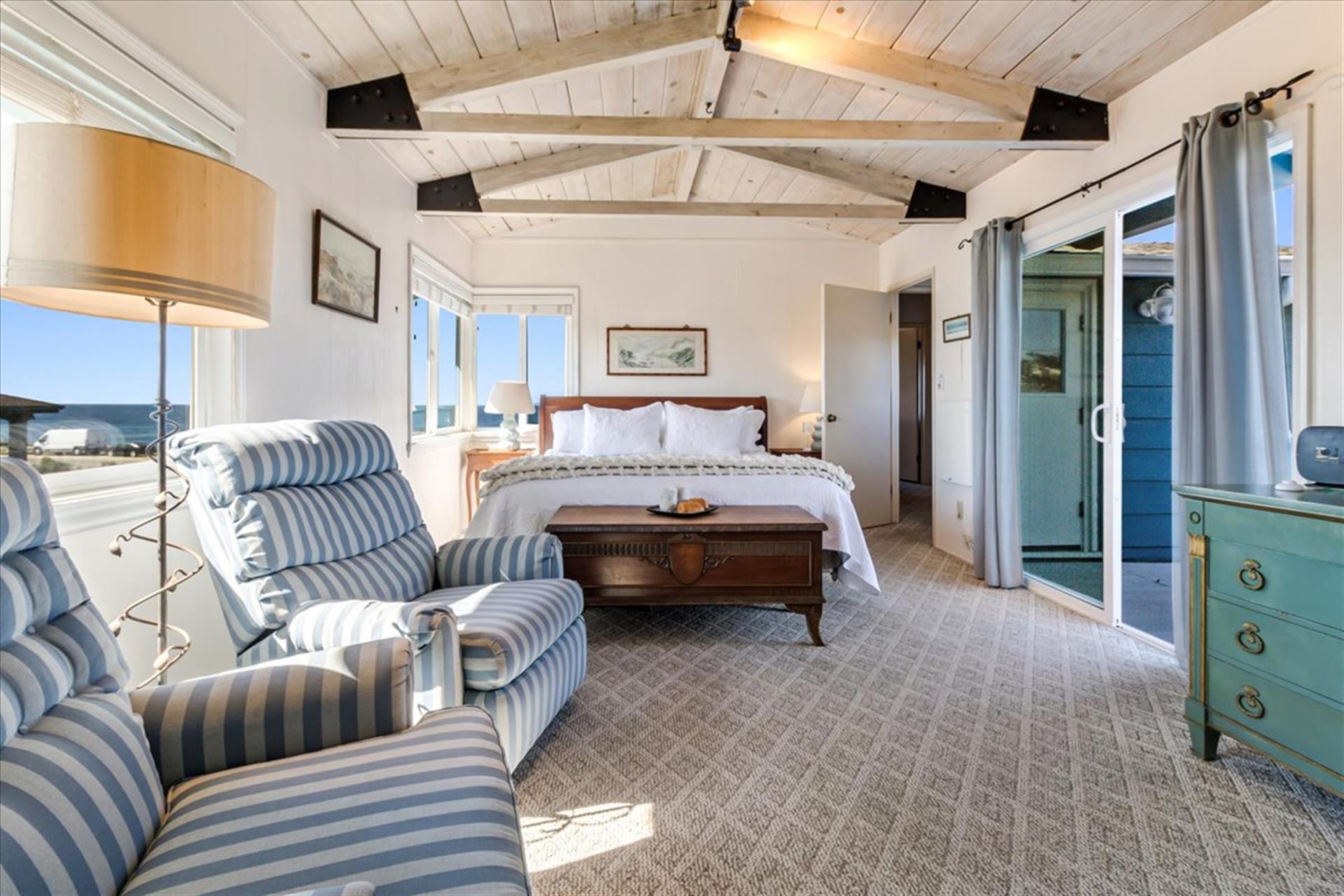 Bedroom 1 has a King Bed and a Slider to a Private Deck