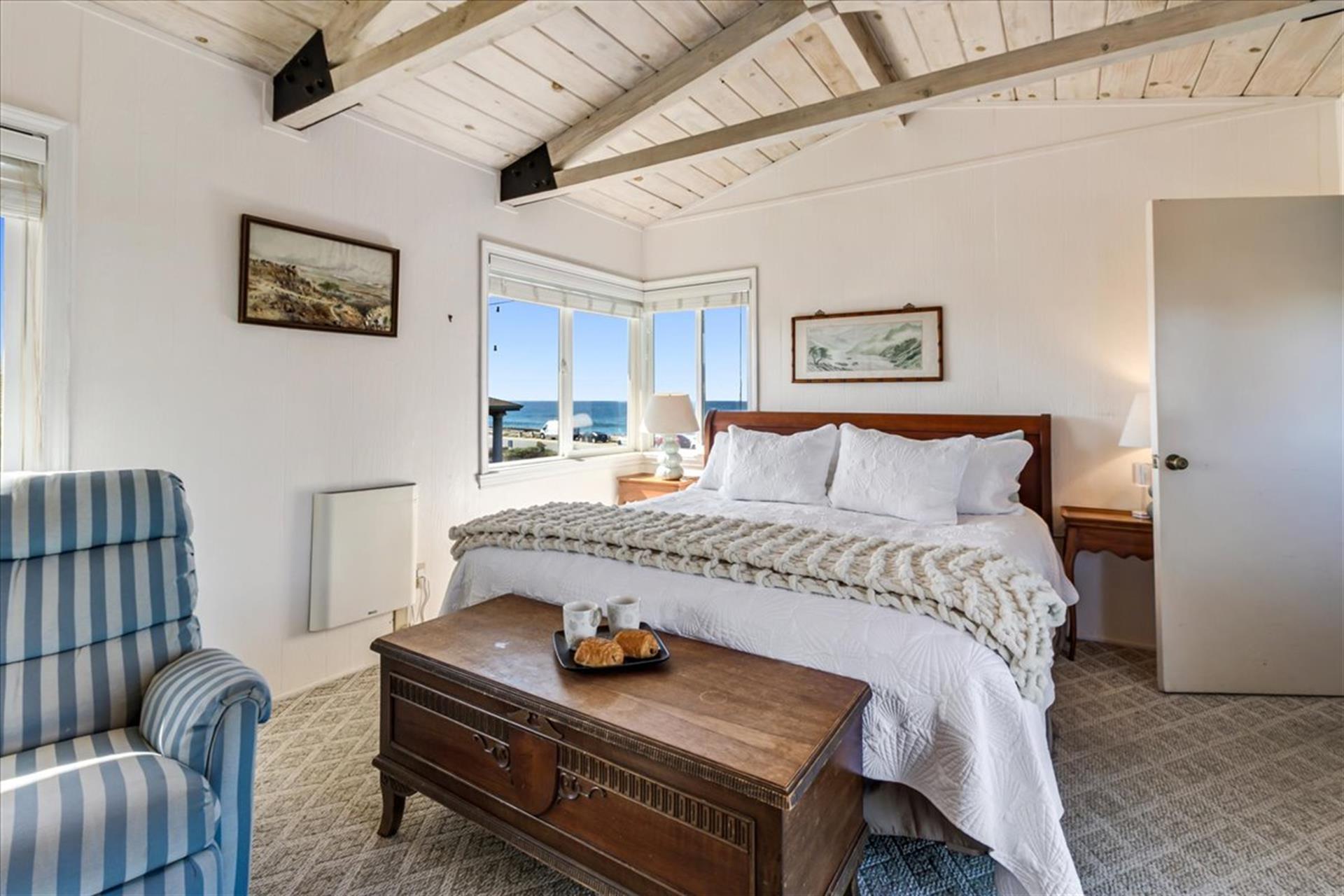 Bedroom 1 has a King Bed and a Bay View