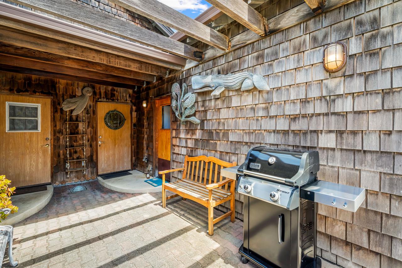 Back Door Leads Out to a Gas BBQ Grill