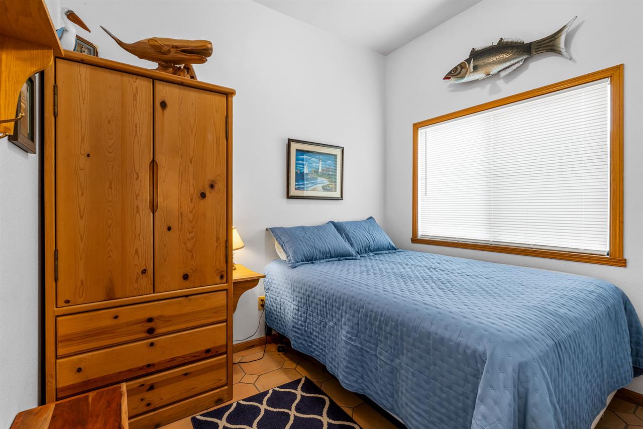 Bedroom 2 has a Queen Bed and TV