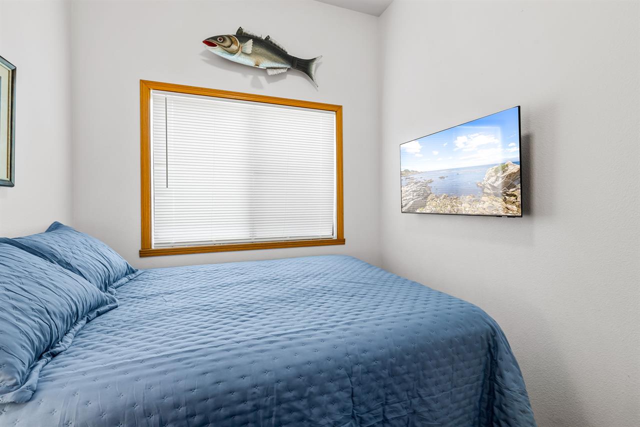 Bedroom 2 has a Queen Bed and TV