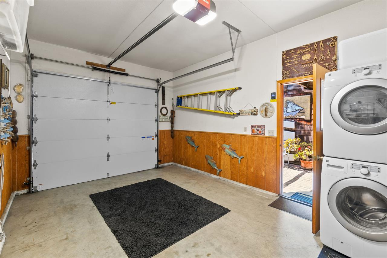 A Washer and Dryer Come are in the Garage