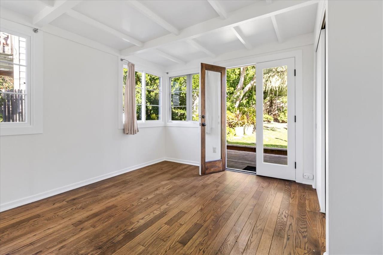 Bedroom 1 has French Doors that Lead to the Backyard Deck