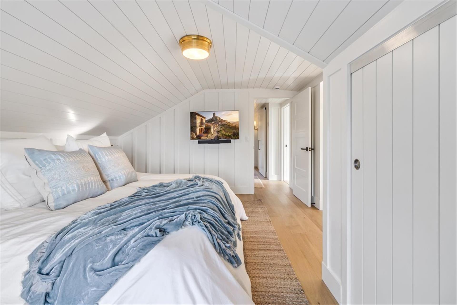 Bedroom 3 has a King Bed and a TV