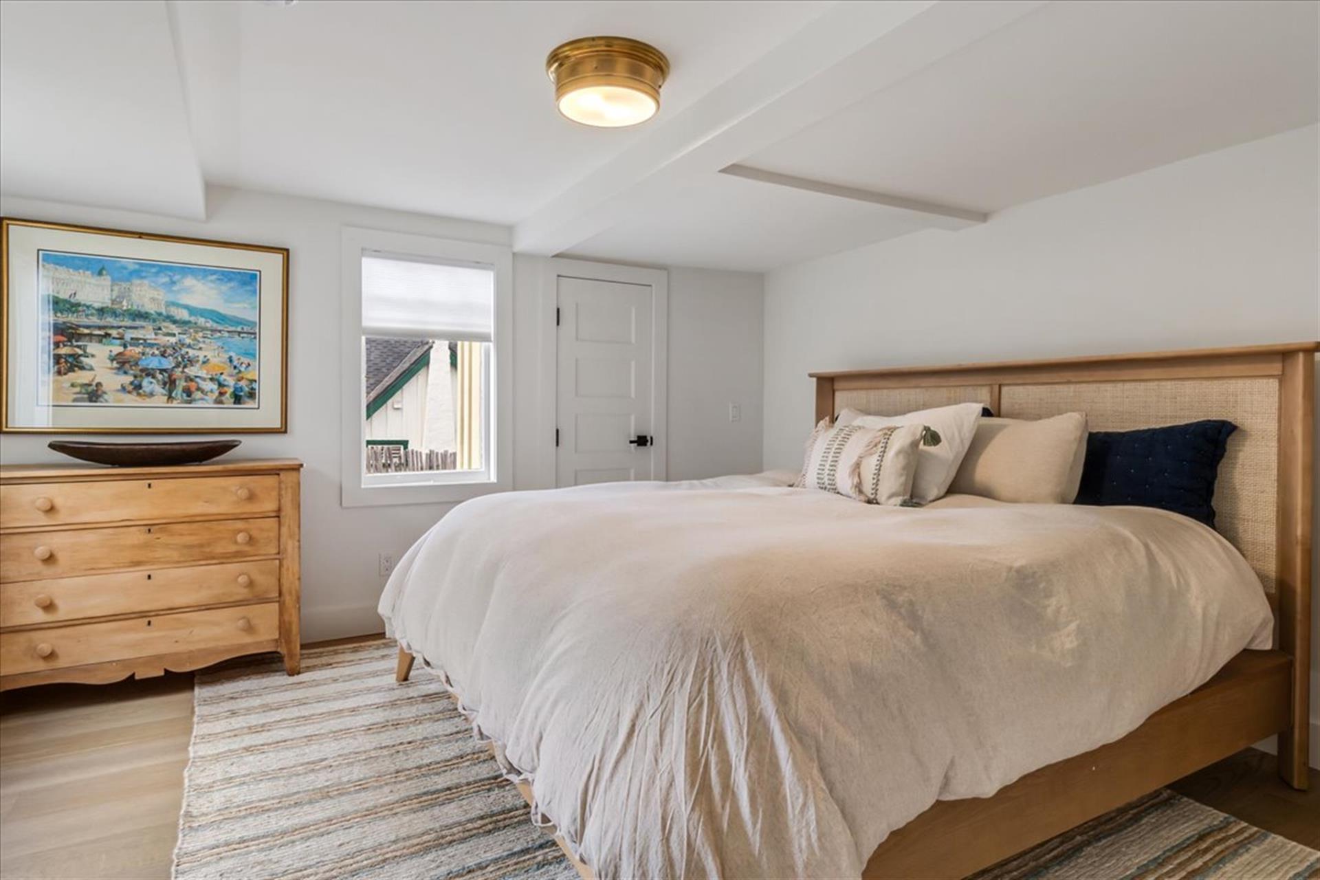 Downstairs Bedroom 1 has a King Bed and TV