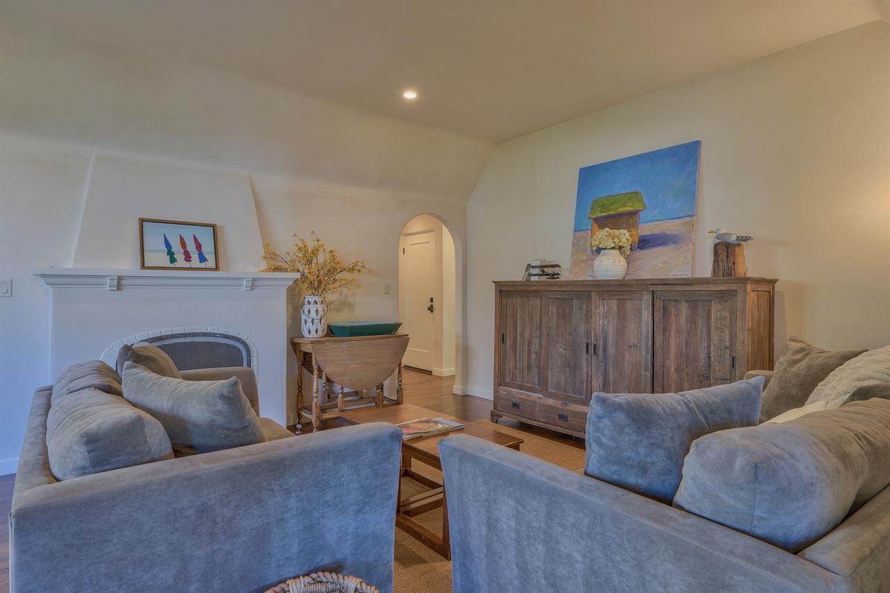 Living Room has a gas log fireplace, TV, and BlueRay DVD