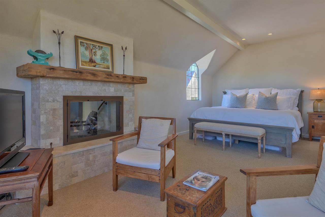 Bedroom 1  King Bed, Gas Fireplace and Sitting Area with a TV