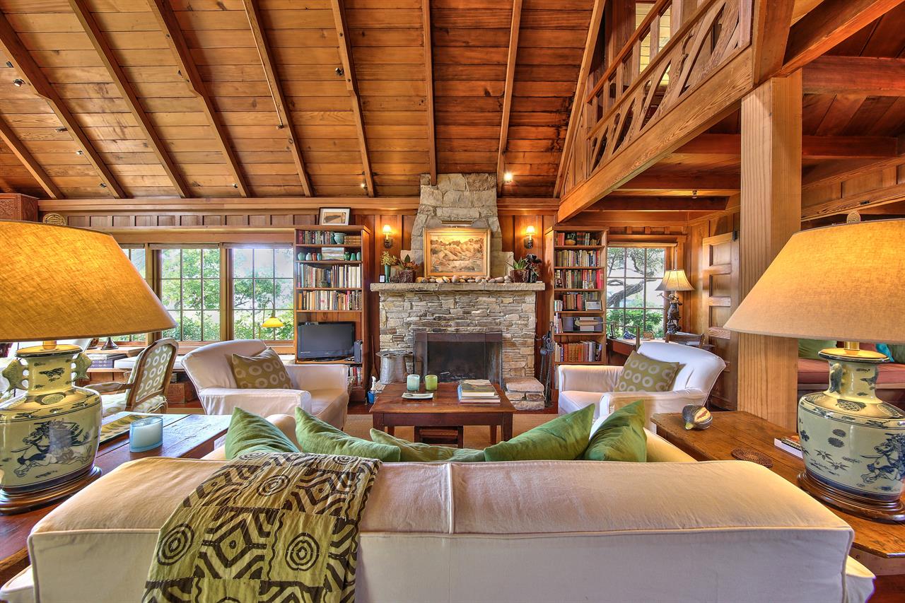 Living Room has a Classic Carmel Stone WoodBurning Fireplace