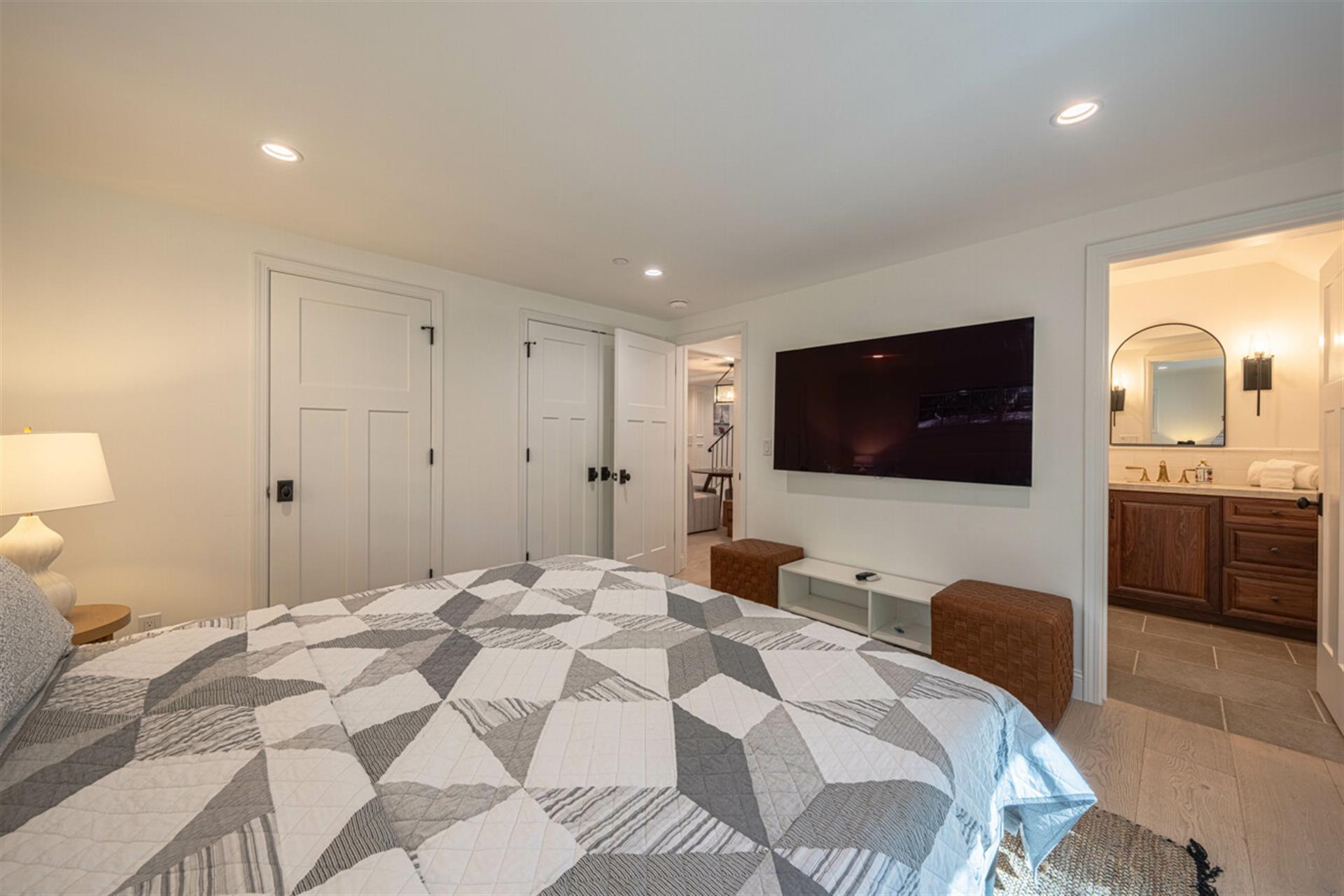 Bedroom 1 has a King Bed and EnSuite Bath with a Shower