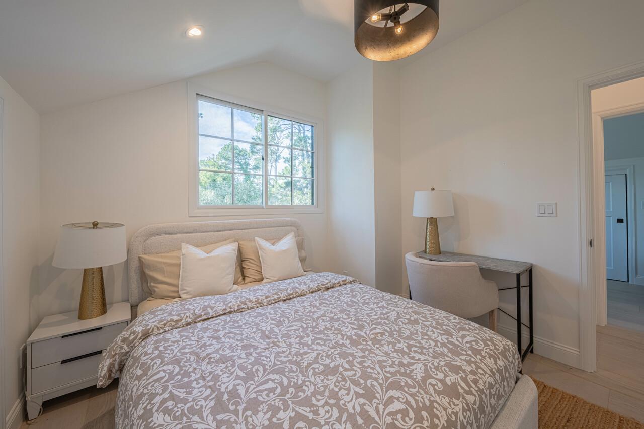 Bedroom 2  Queen Bed and a Small Writing desk and Chair