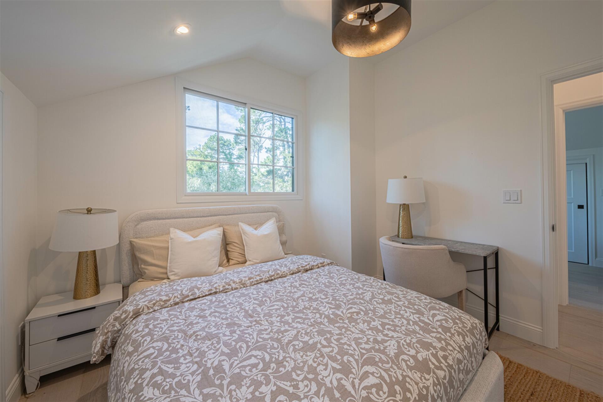 Bedroom 2  Queen Bed and a Small Writing desk and Chair