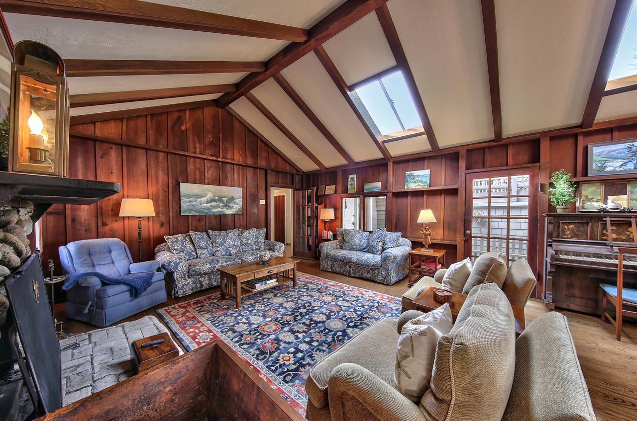 Living Room has Skylights and a Piano