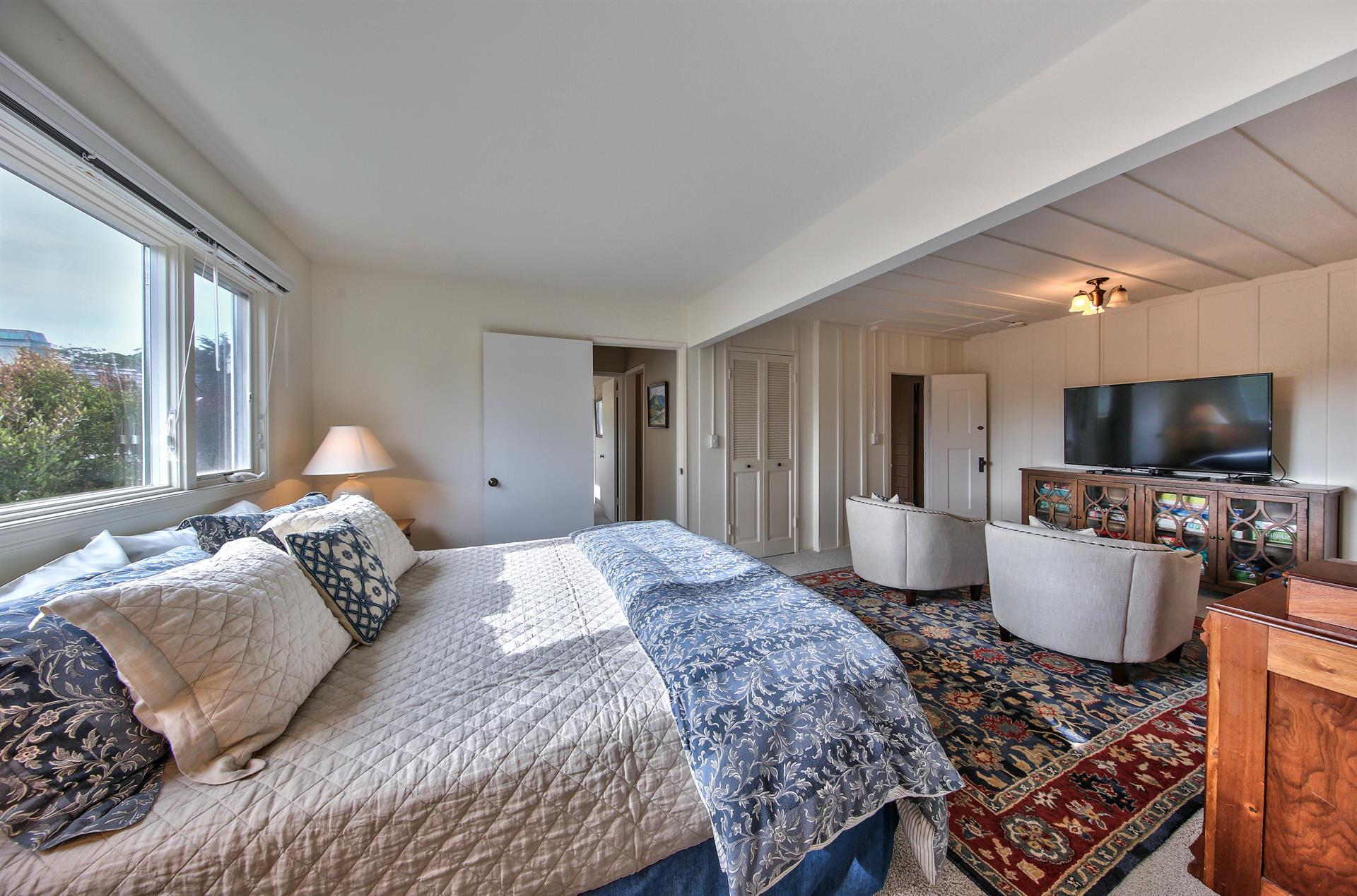 Downstairs Bedroom 1 has a King Bed and TV