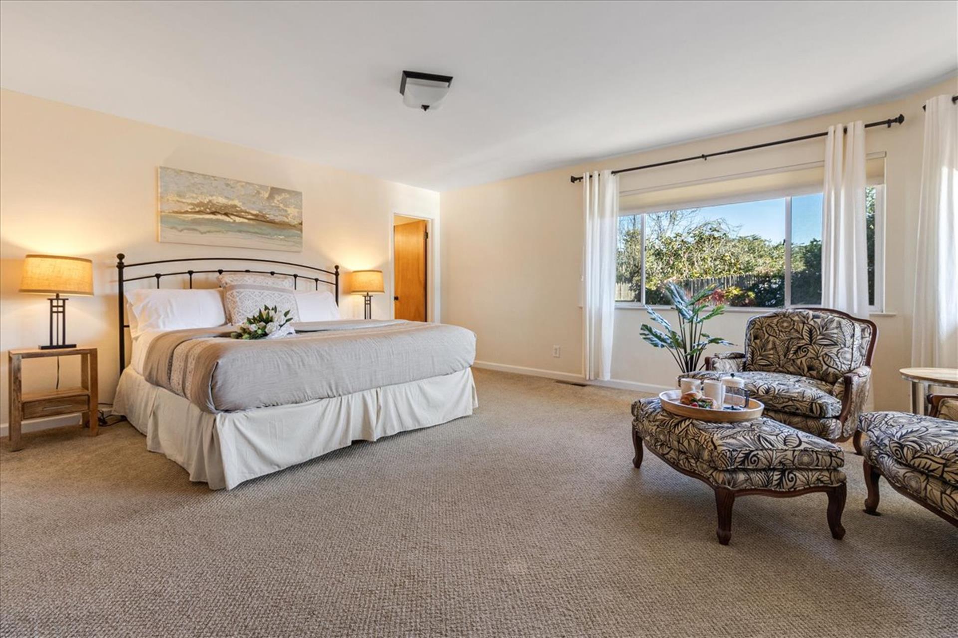 Bedroom 1  Primary Suite has a King Bed and TV