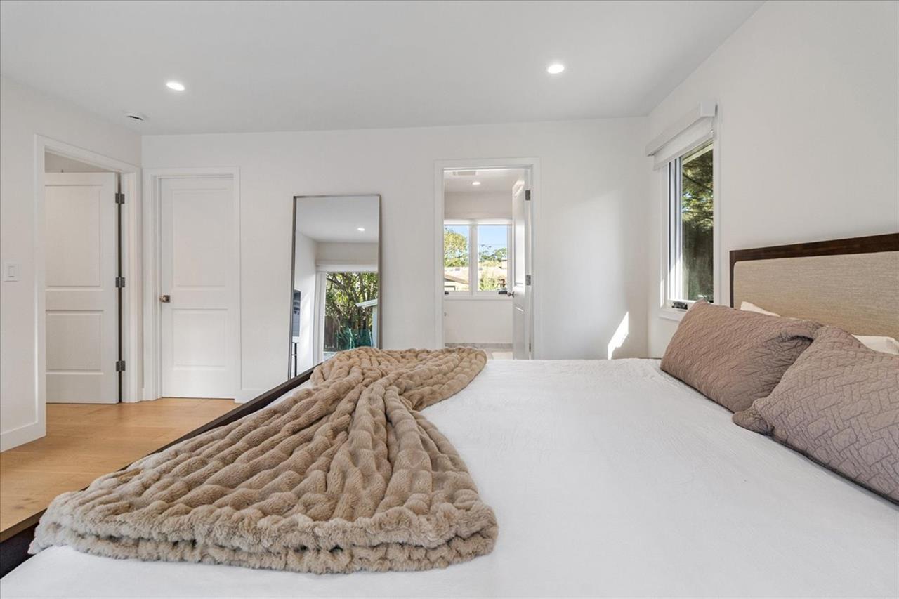 Bedroom 1 has a King Bed and EnSuite Bath