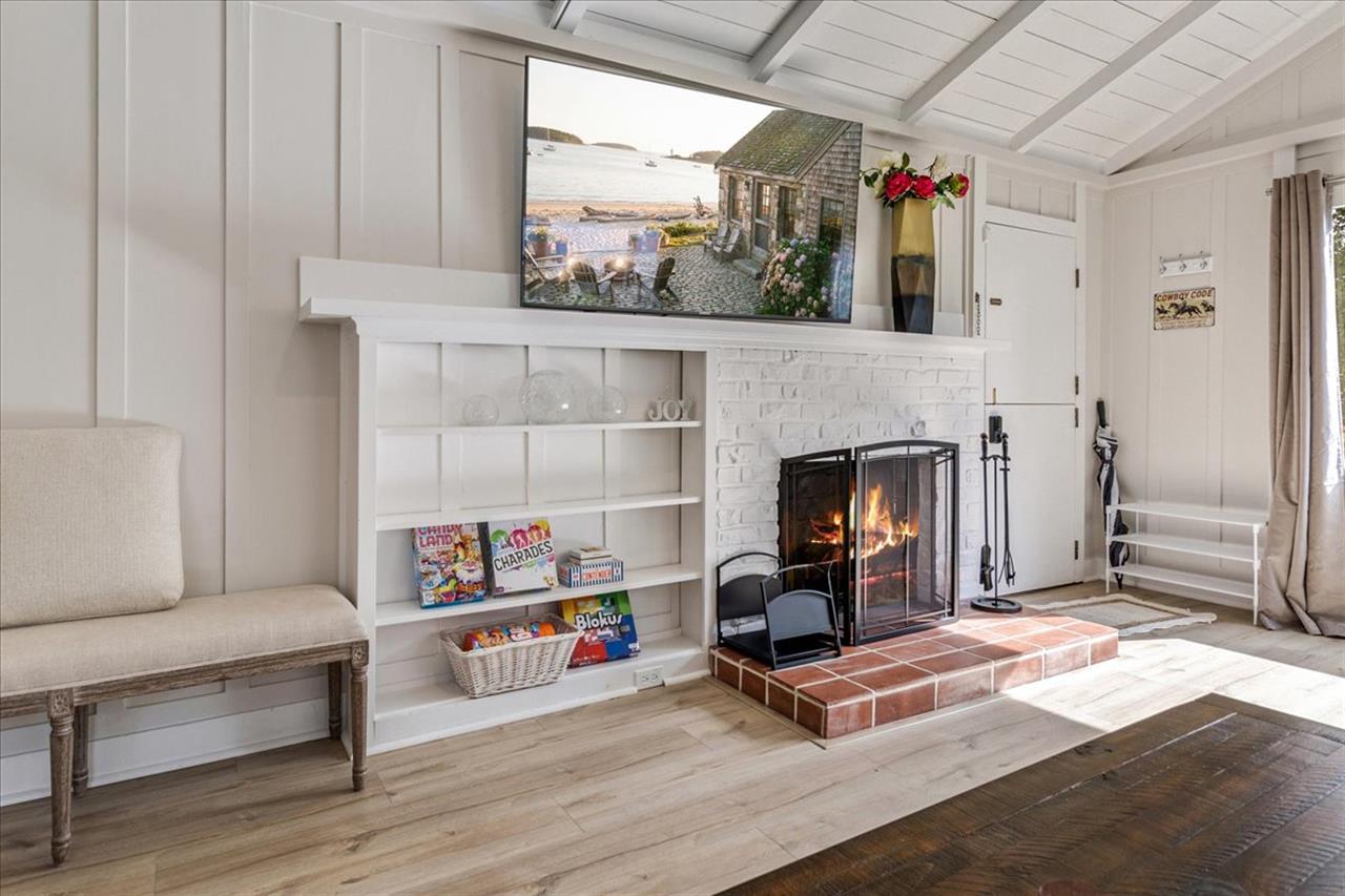 Living Room has a WoodBurning Fireplace and Smart TV