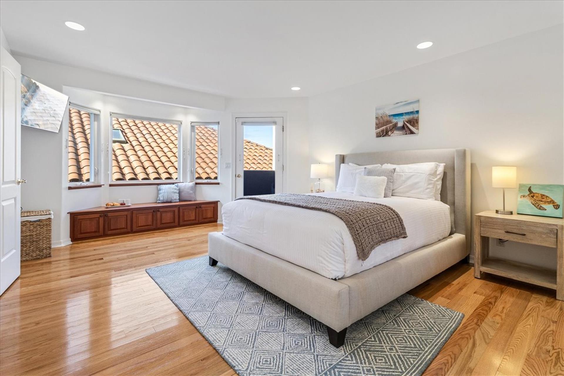 Bedroom 2 has a Queen Bed, Smart TV and a Bay View Balcony