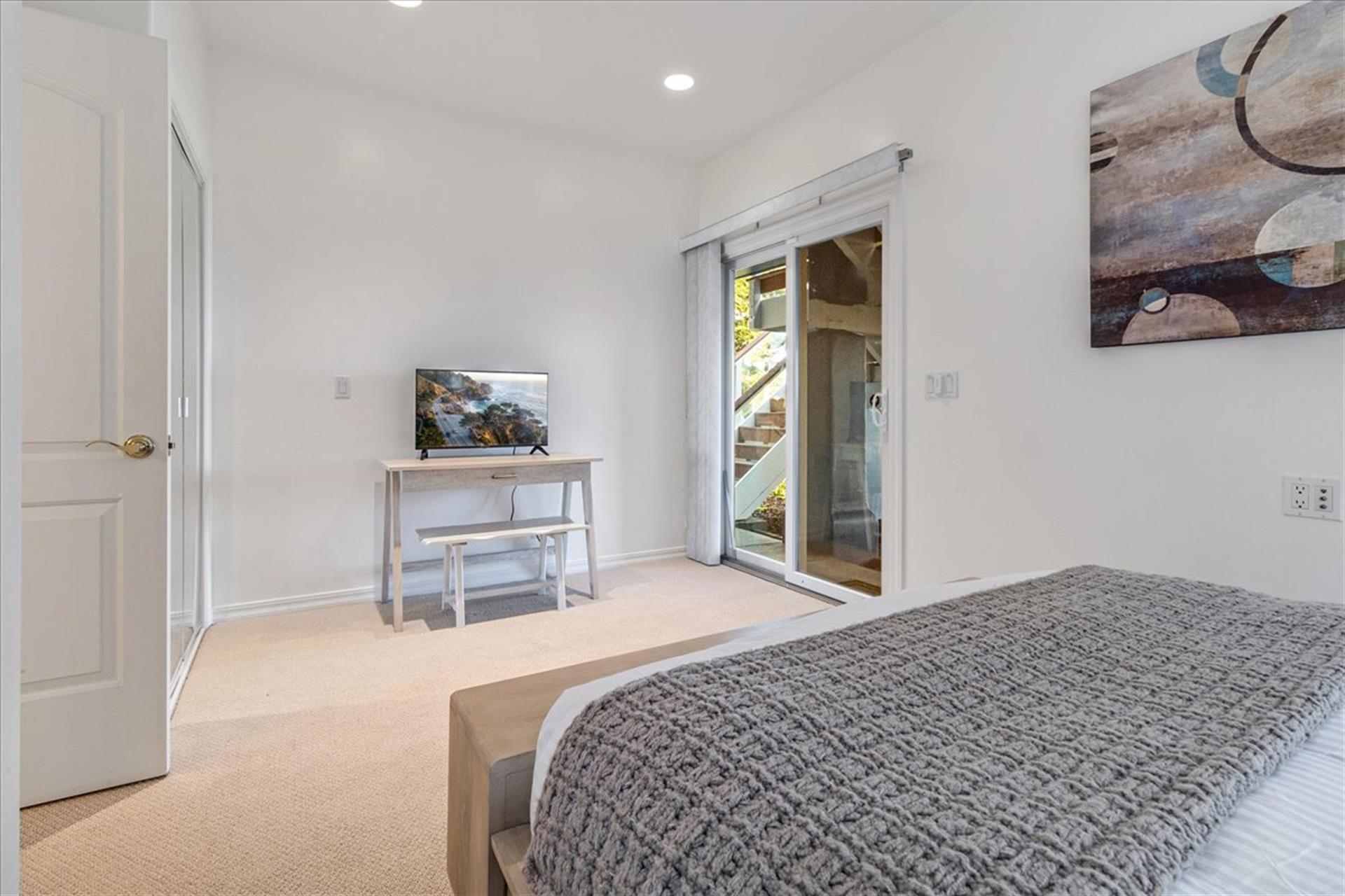 Bedroom 3 has a Queen Bed, Smart TV and a Desk