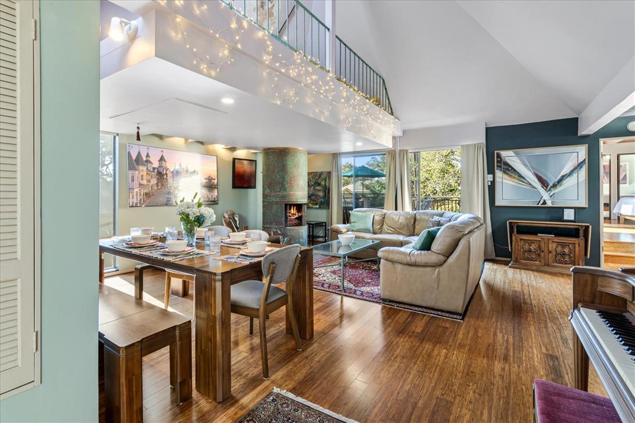 Living Room and Dining Area has a Fireplace and Large TV