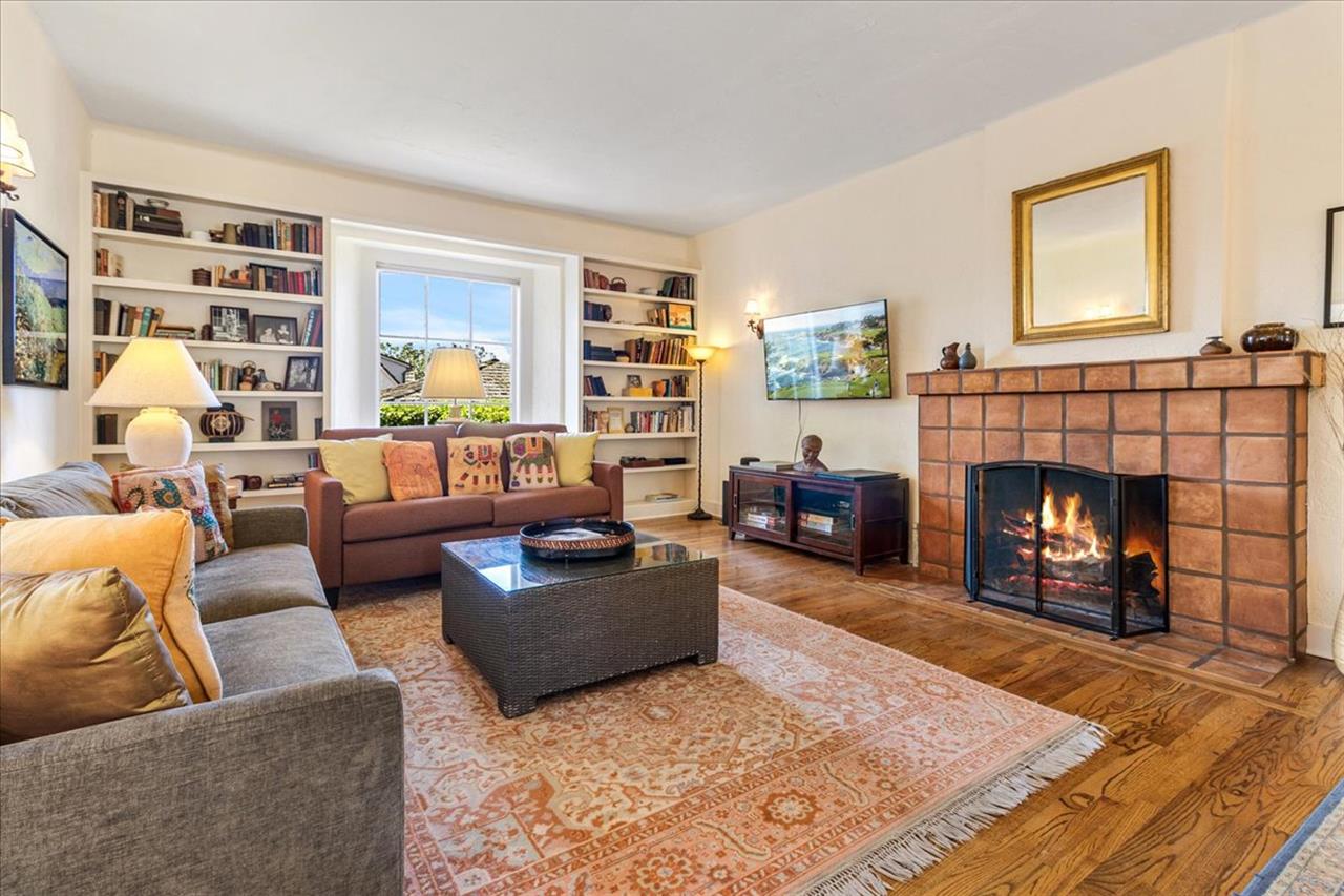 Living Room has a Decorative Fireplace and a Smart TV