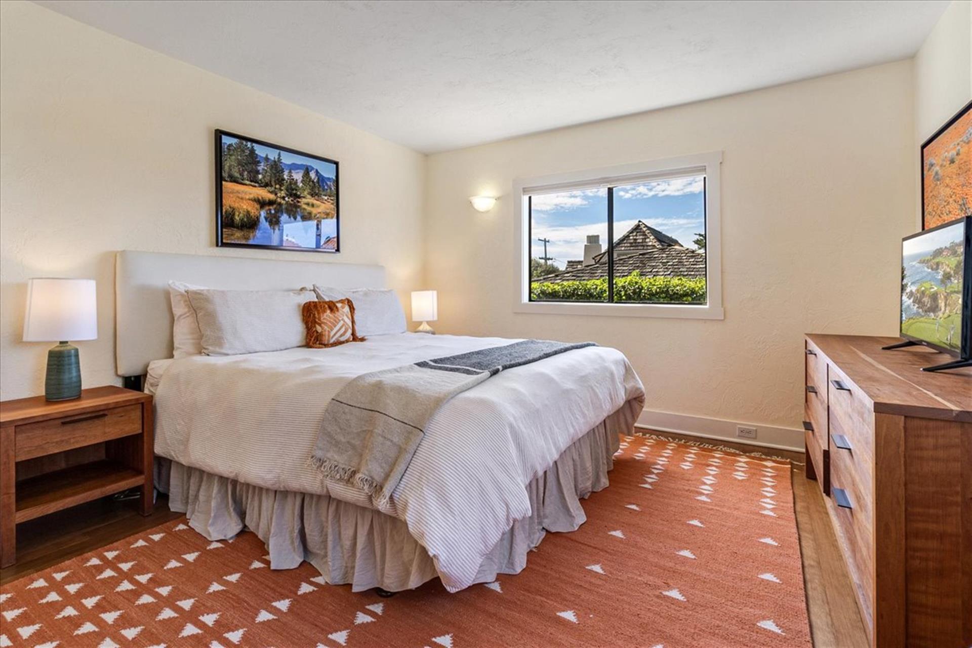 Bedroom 1 has a King Bed and a TV