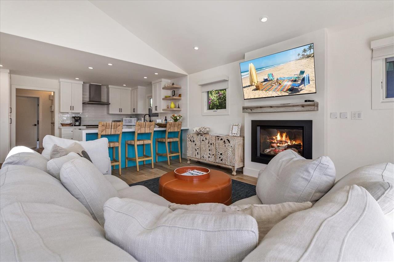 Living Room Area has a Gas Fireplace and Large Smart TV