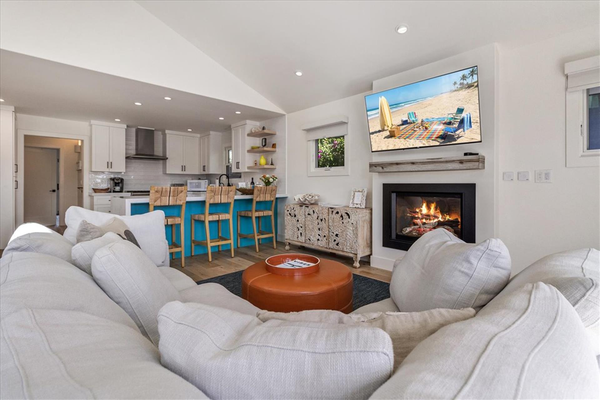 Living Room Area has a Gas Fireplace and Large Smart TV