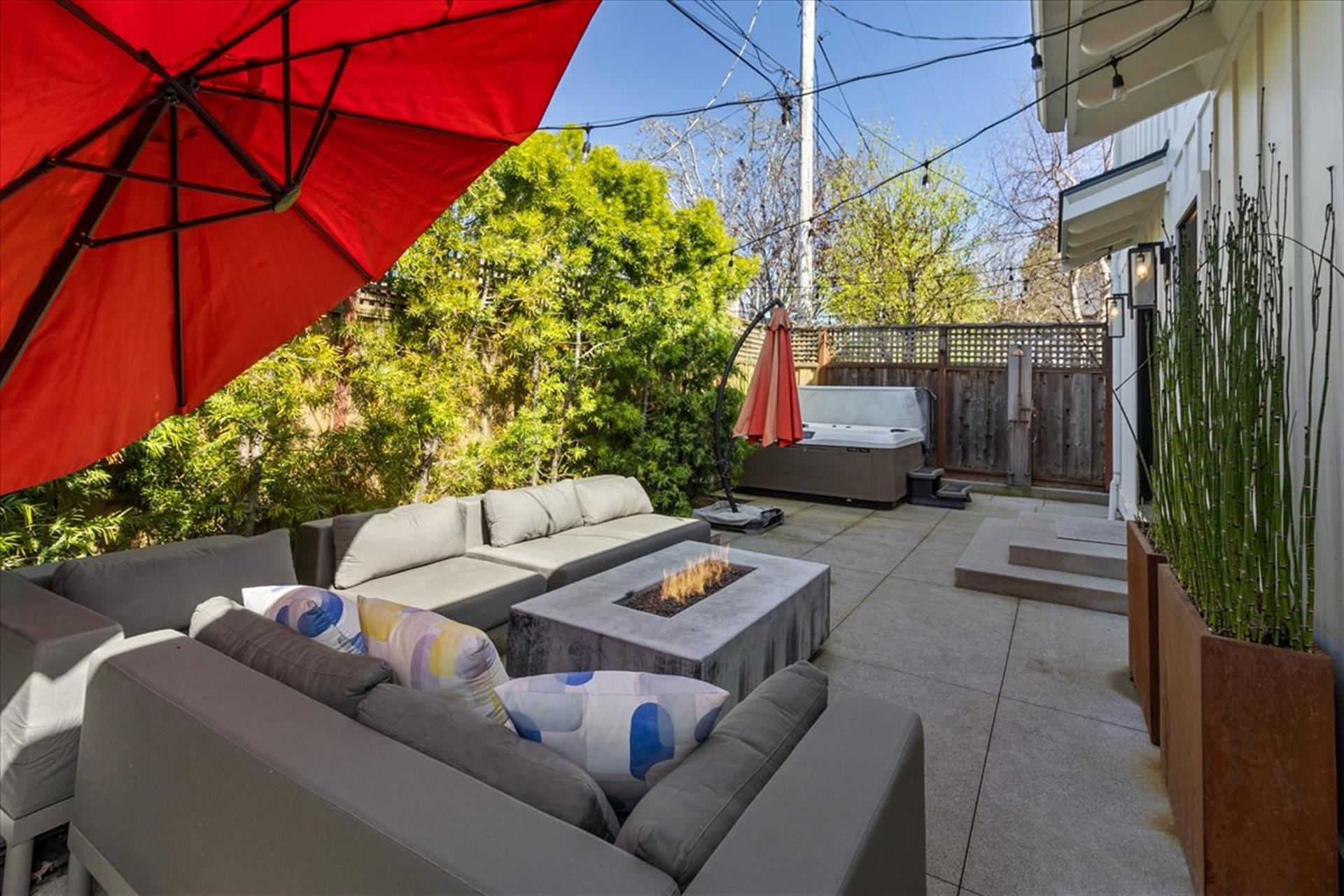 Backyard has a Fire Pit, Hot Tub and an Outdoor Shower