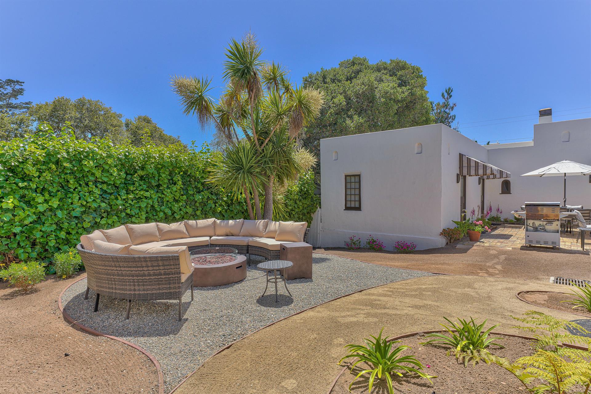 Exterior Seating and Dining Area with Grill
