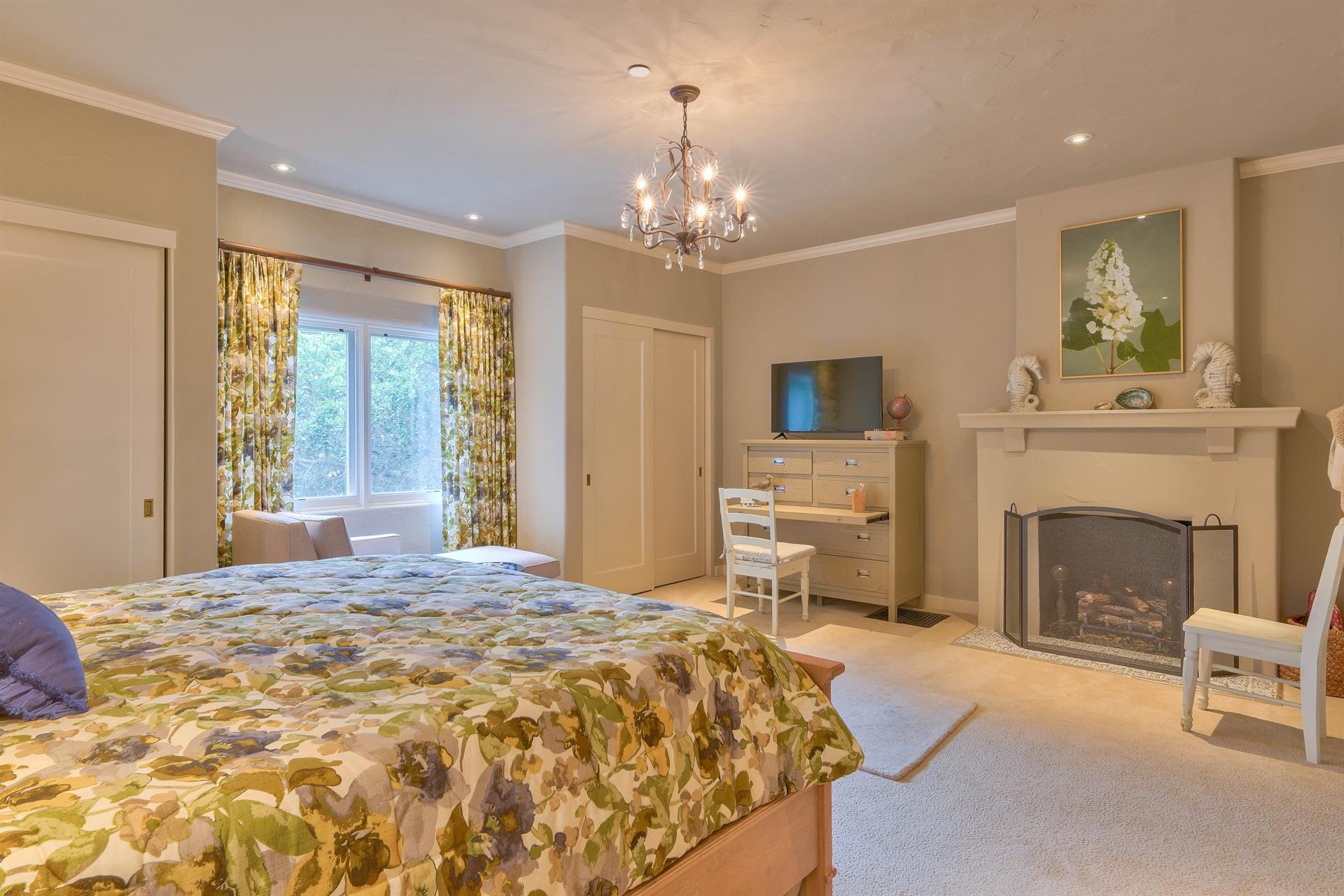 Bedroom 1  King Bed, Decorative Only fireplace