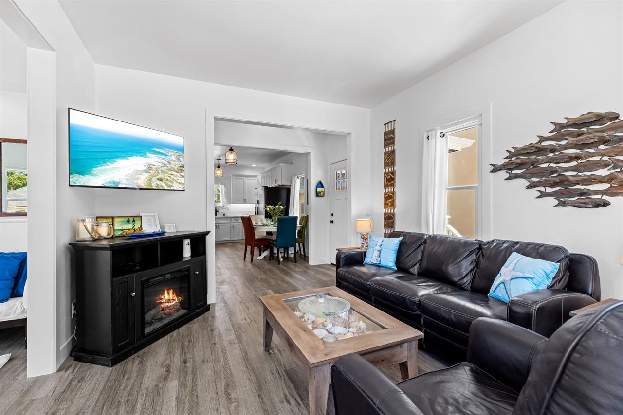 Living Room has a 48 TV, Fireplace and a Queen Sofa Bed