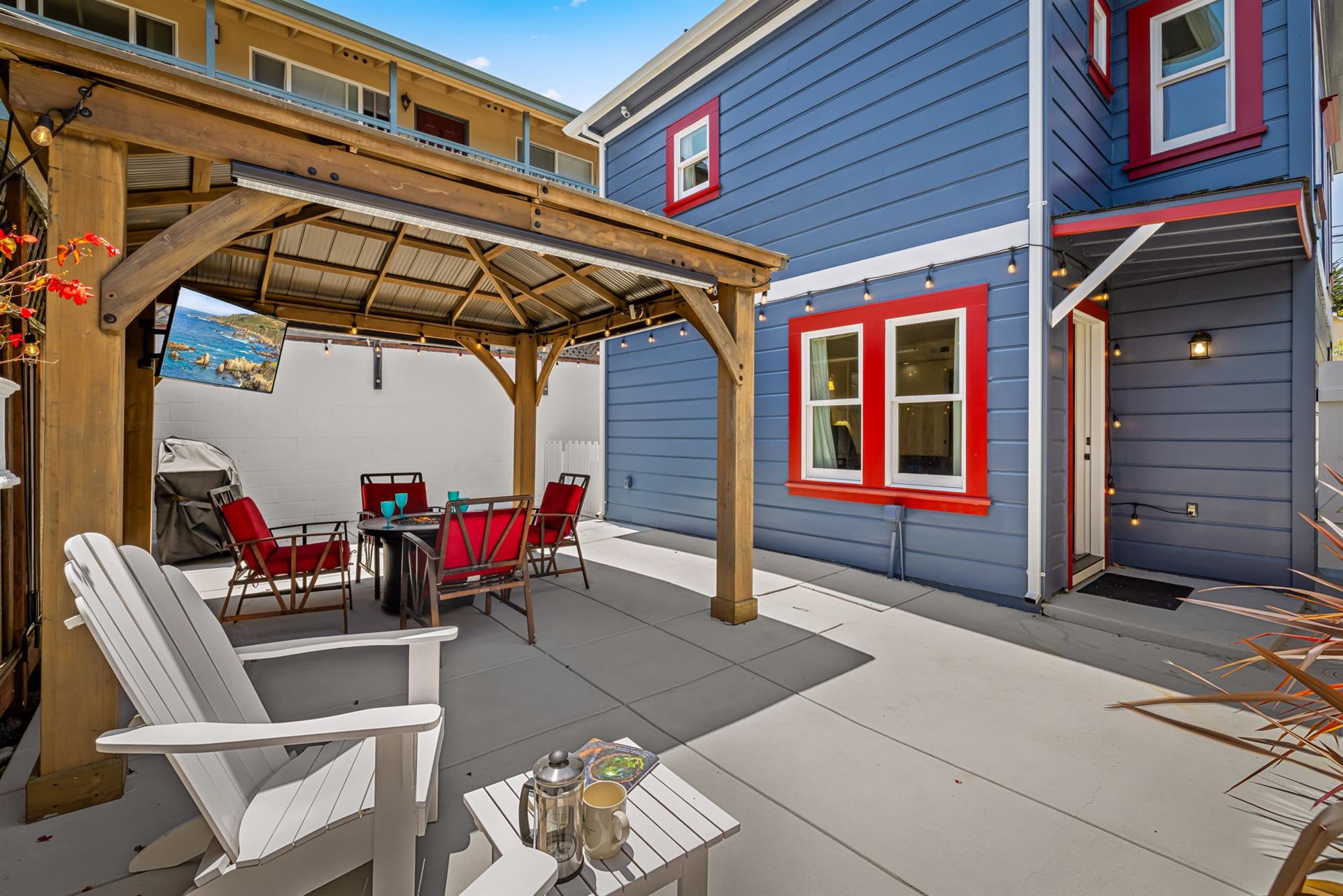 Backyard has a Gas Grill, Fire Pit Table and TV