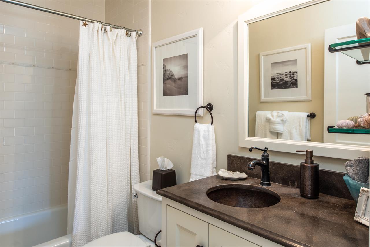 HallwayAccessed Bathroom with Shower Over Tub