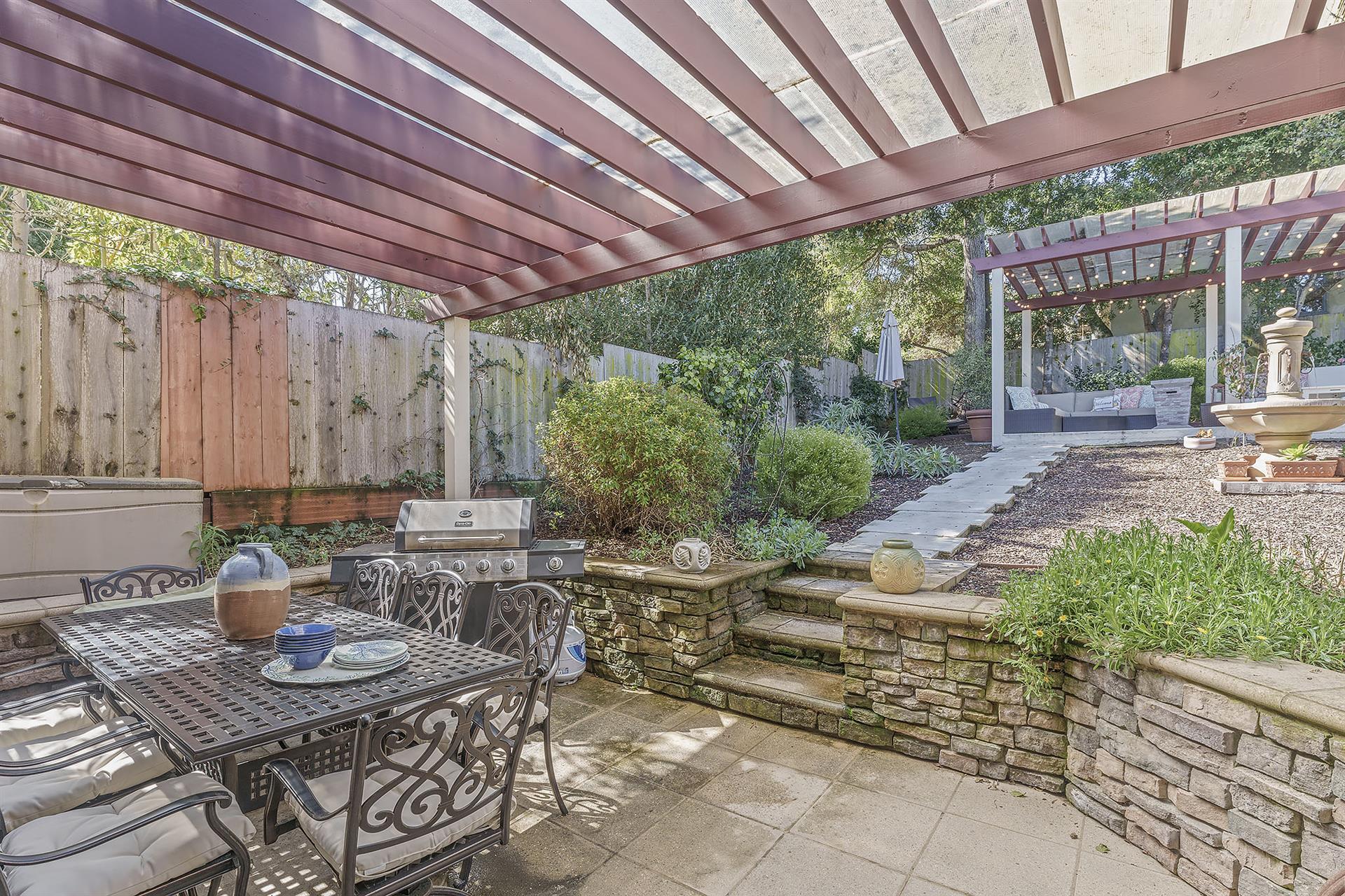 Backyard Dining Area has a Propane Gourmet Gas Grill