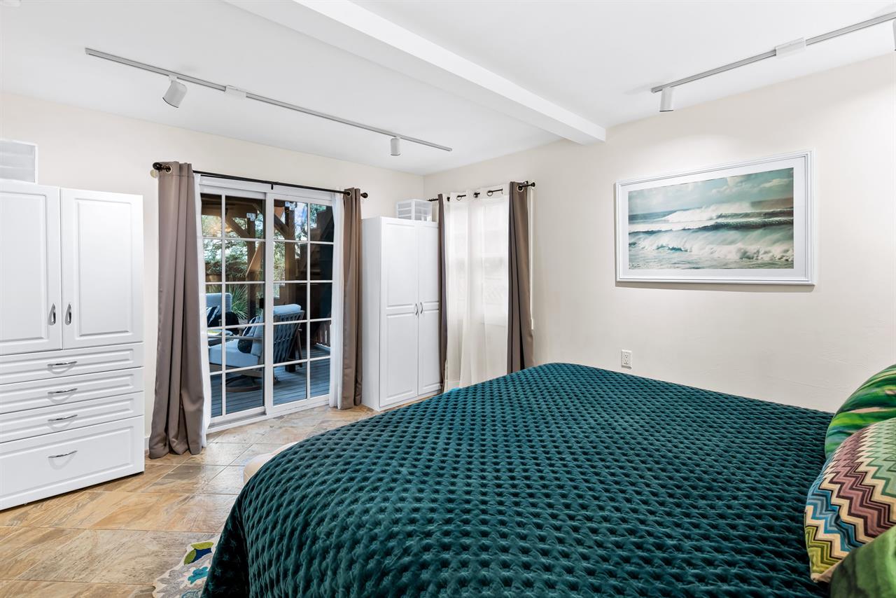 Bedroom 4  Downstairs, has access to the Patio and Gardens