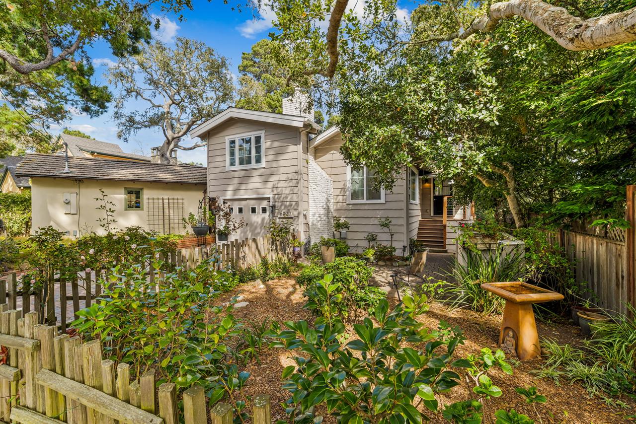 Front of the Home has Gardens and a Seating Area