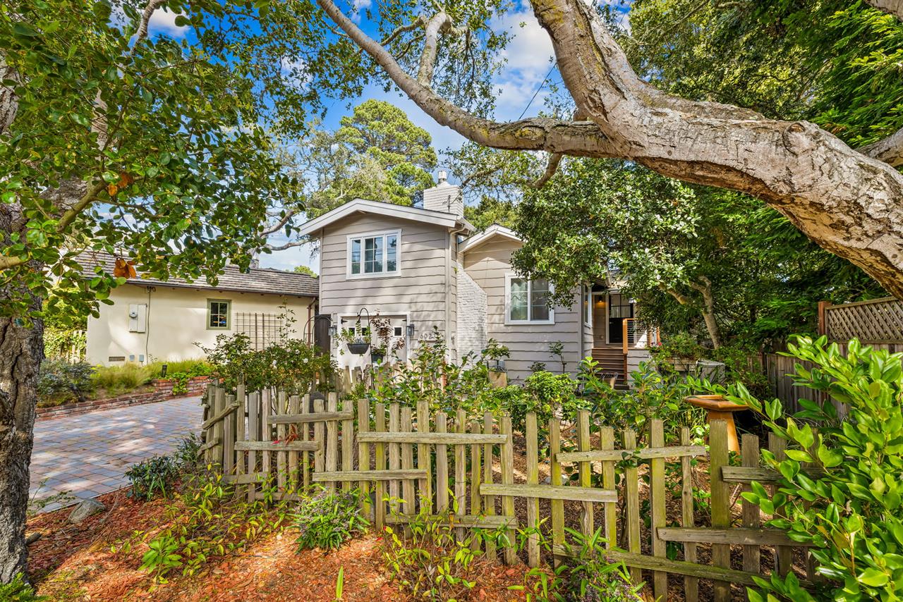 Front of the Home has Gardens and a Seating Area