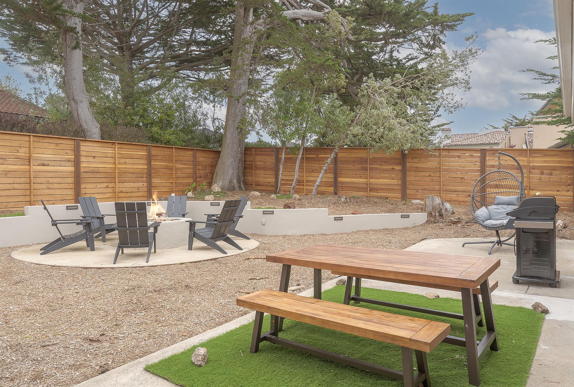 Fenced Back Yard with Seating, Fire Pit and Gas BBQ