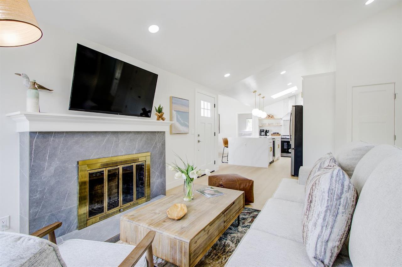 Living Room with Decorative Fireplace and HDTV