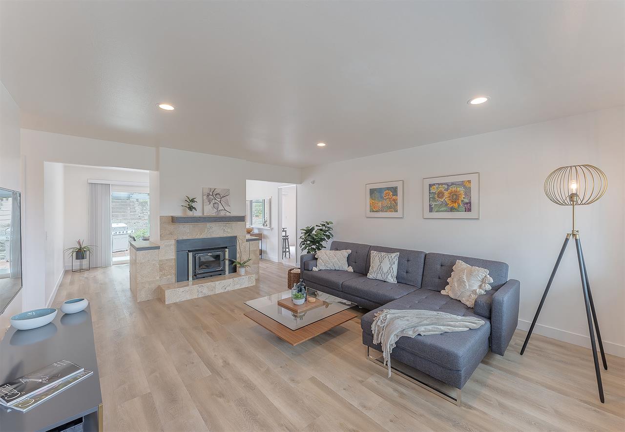 Living Room has a Candlelit Fireplace and HDTV