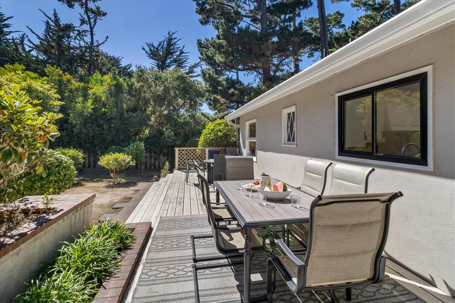 Backyard Deck has a Gas Grill, Dining Area and a Fire Pit