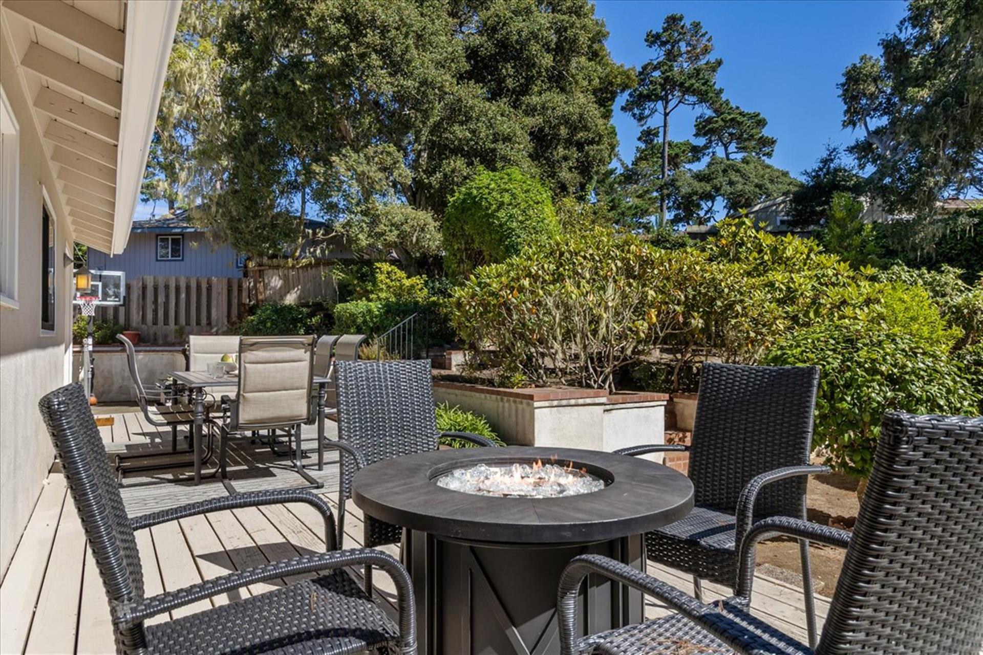 Backyard Deck has a Gas Grill, Dining Area and a Fire Pit