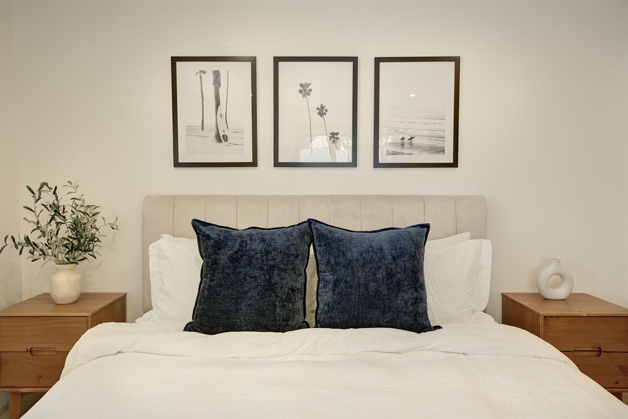 Bedroom 1 has a King Bed and EnSuite Bath with a Shower