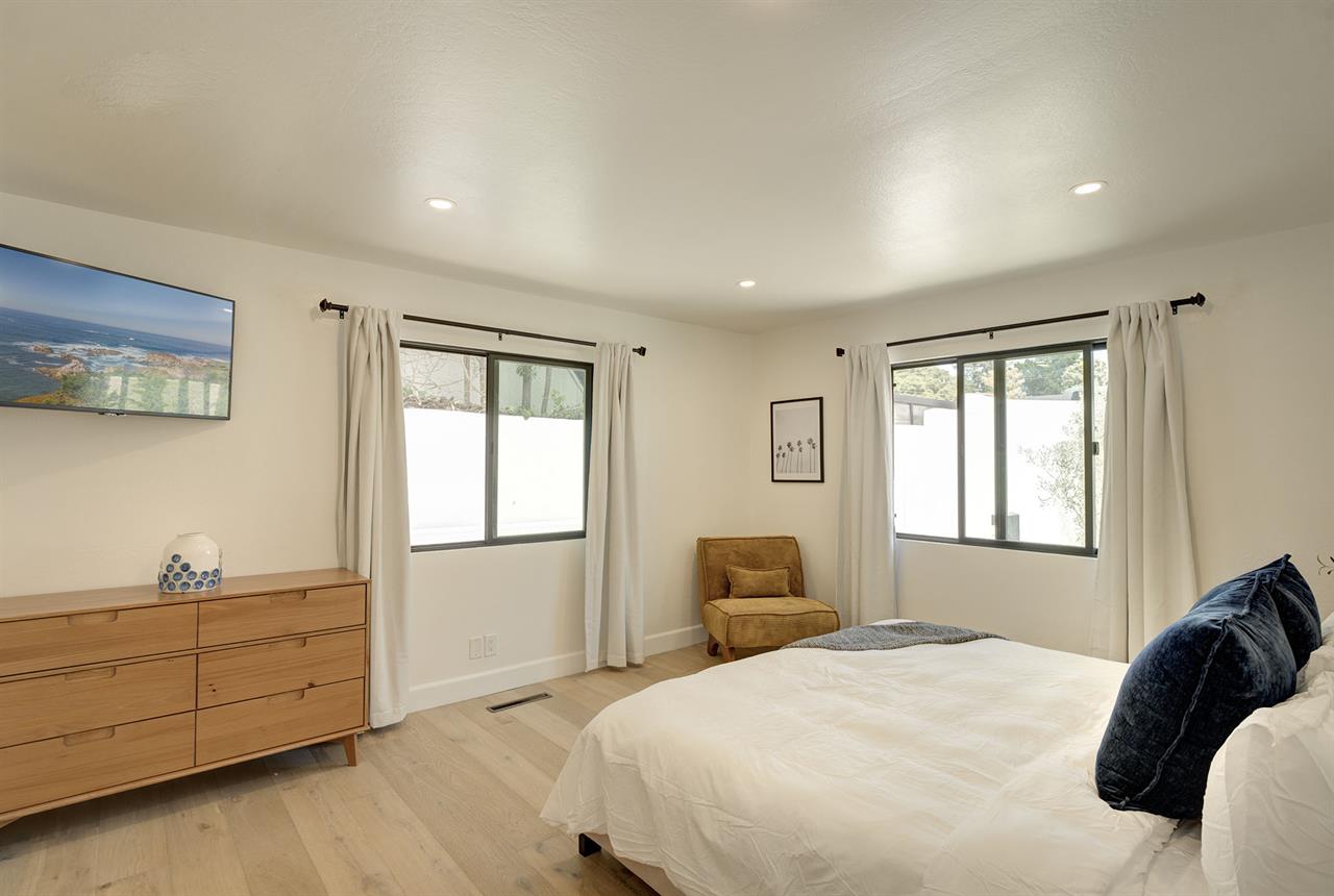 Bedroom 1 has a King Bed and EnSuite Bath with a Shower