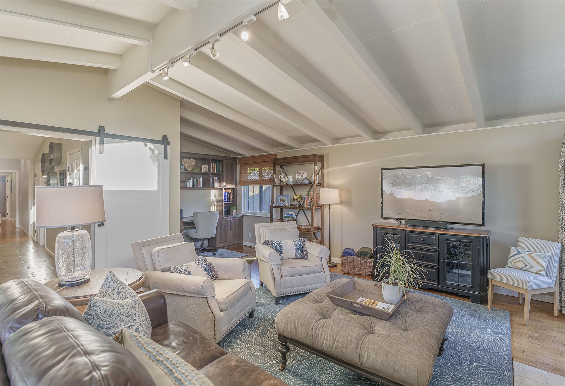 Living Room with HDTV and a Dedicated WorkspaceOffice Area