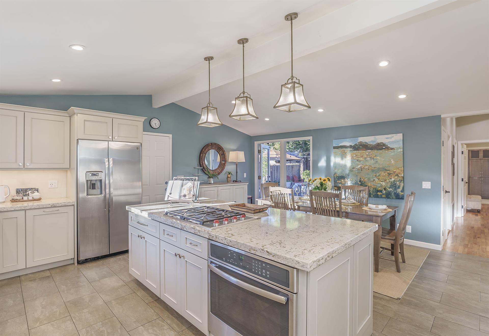 Updated Kitchen with Island and Stainless Steel Appliances
