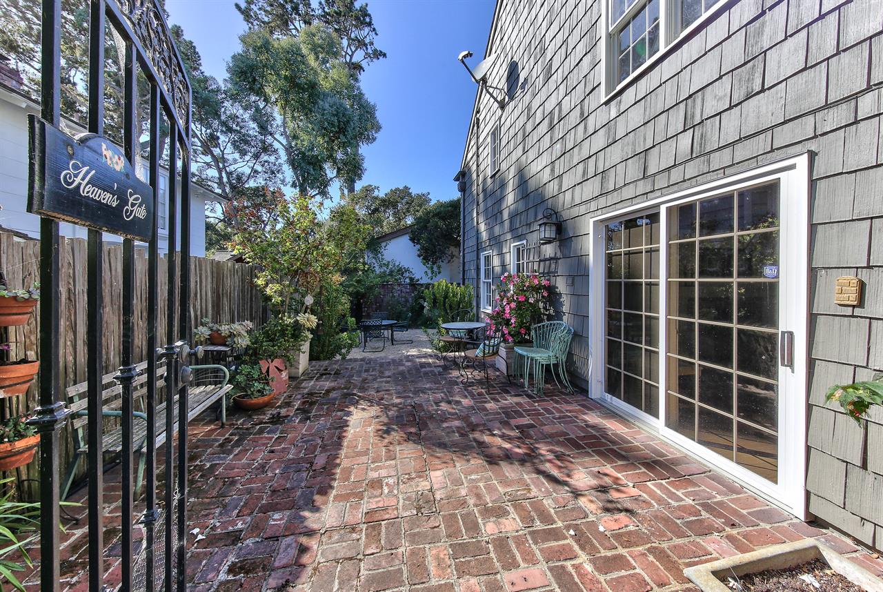 Patios and Mature Landscaping Surround the Home