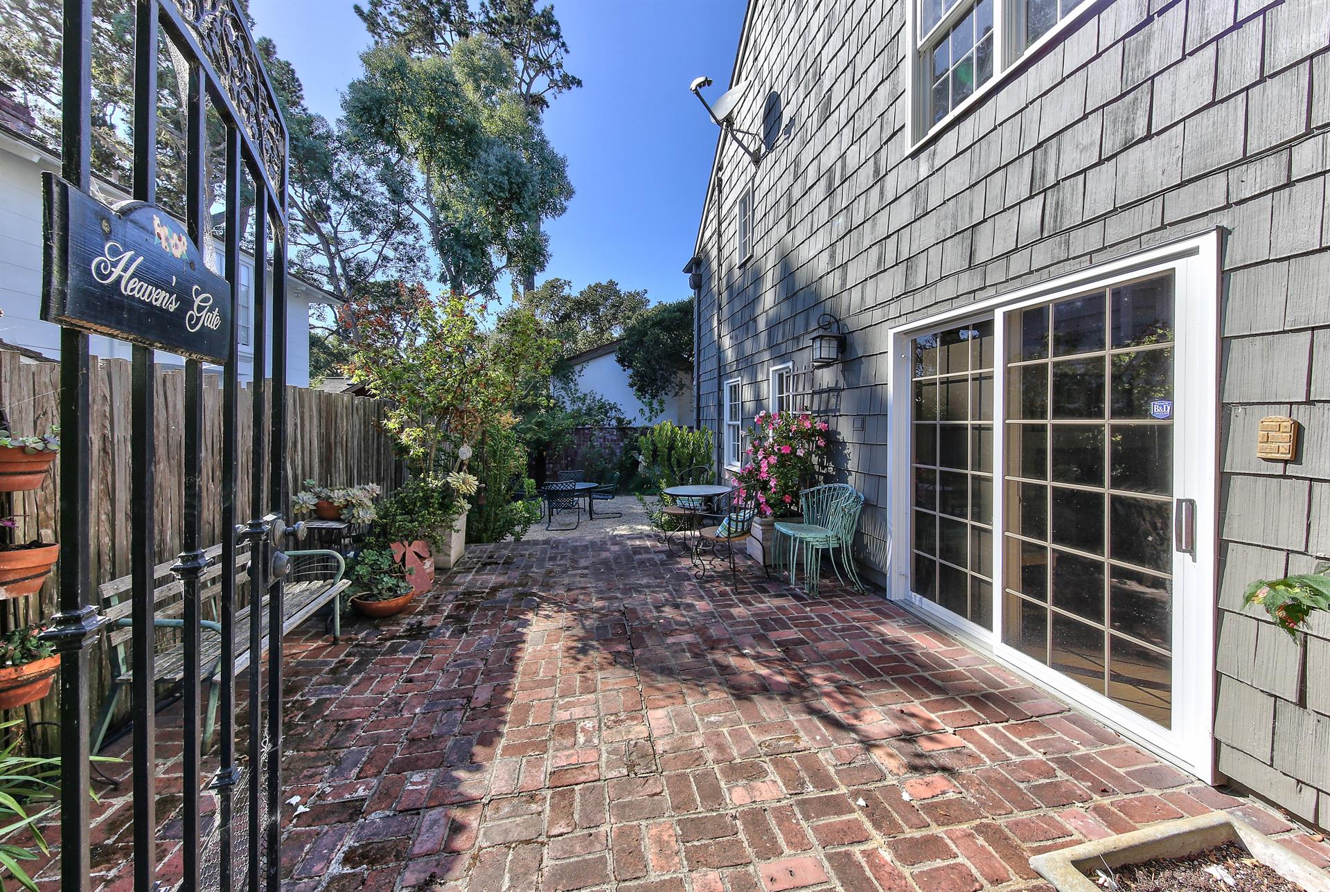 Patios and Mature Landscaping Surround the Home