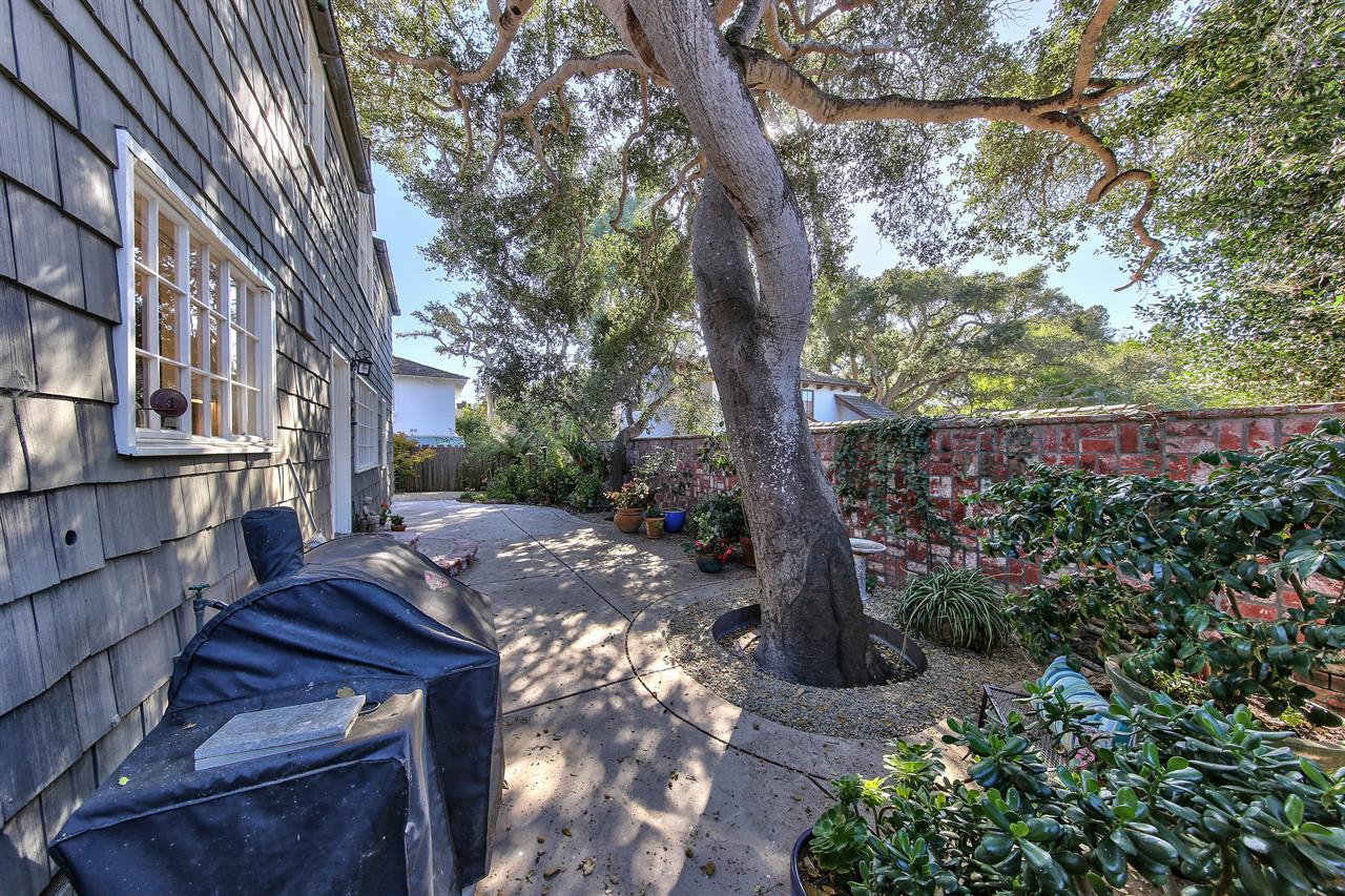 Patios and Mature Landscaping Surround the Home